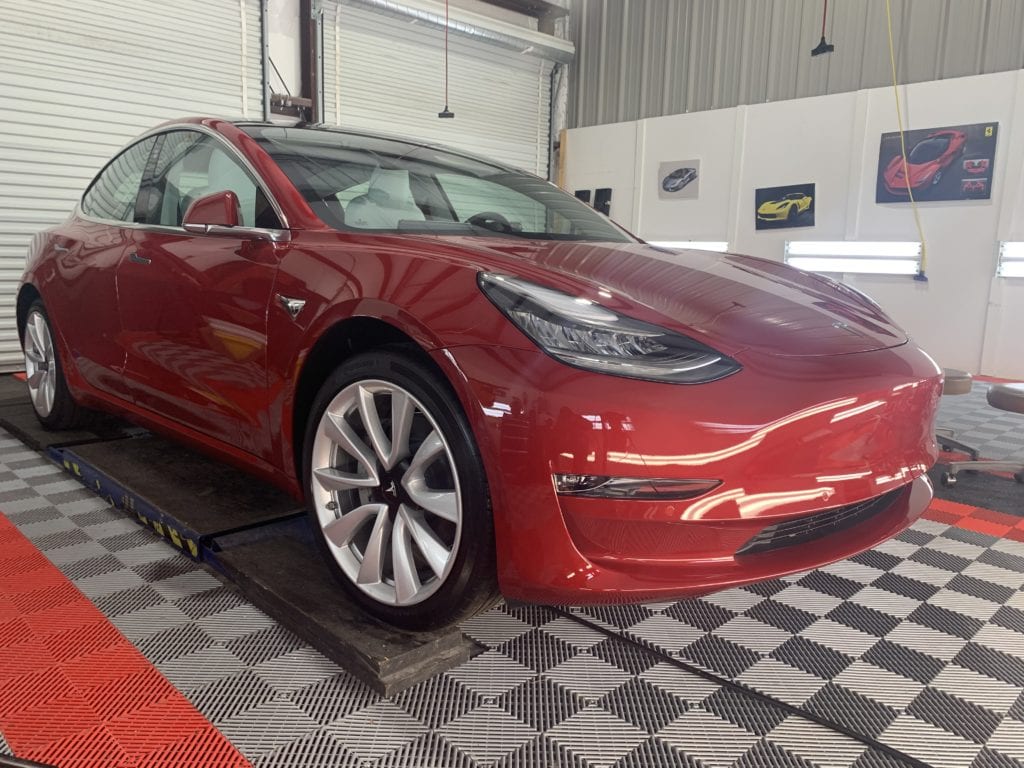 Photos of a New Car Preparation of a 2019 Tesla Model 3